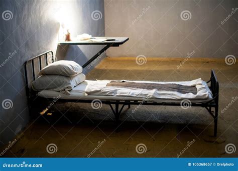 Dark prison cell with bed stock image. Image of detention - 105368657