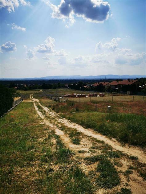 Country road in the countryside. Rural landscape with dirt road and village 26704733 Stock Photo ...