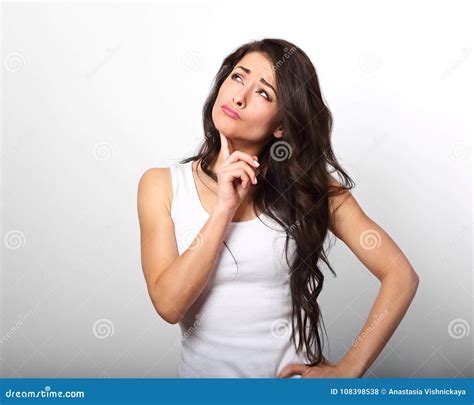 Confusion Grimacing Brunette Woman Thinking And Looking Up In White T