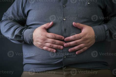 Fat man holds his stomach with his hands. Generative AI 31491929 Stock