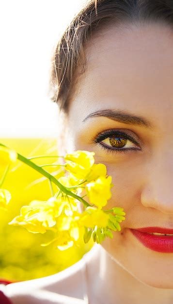 Premium Photo Girl Holding Yellow Flower Near Face Close Up