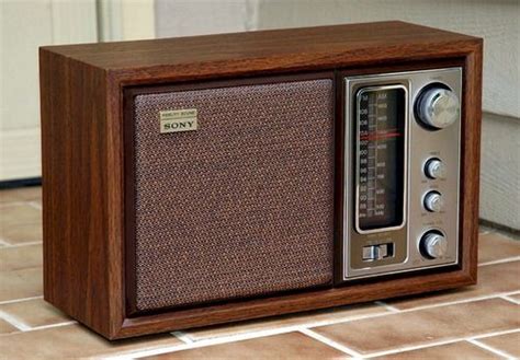 An Old Style Radio Sitting On The Ground