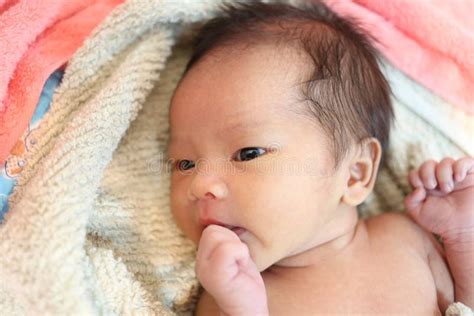 Suspicious Baby Boy Facial Expressions On The Bed Stock Image Image