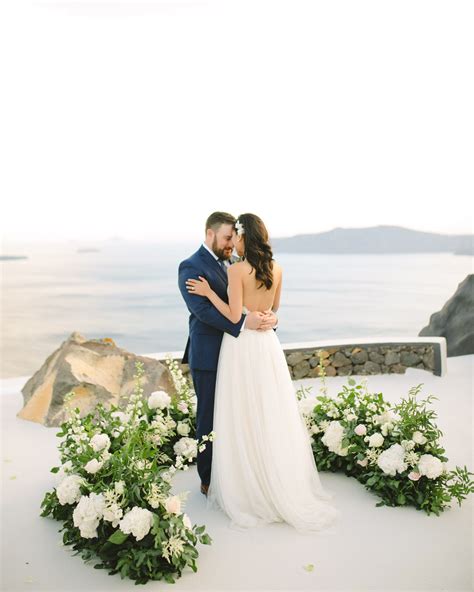 A Wedding Ceremony Trend We Re Loving Grounded Floral Arches Wedding