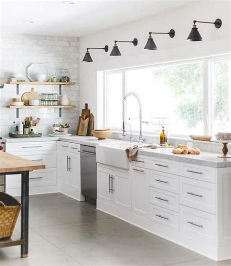 Gorgeous Kitchen With Sconces Over Window Farmhouse Sink And Open