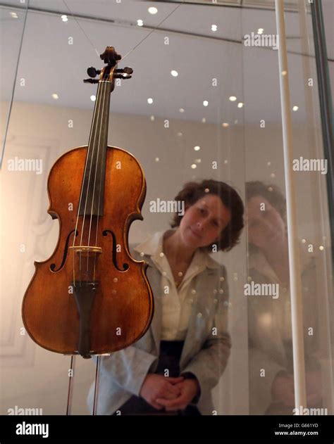 A woman looking at a Stradivarius violin at the new Stradivarius ...