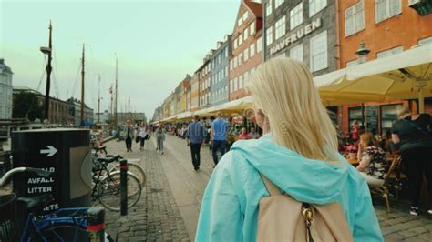 Copenhagen Denmark July A Woman Strolls Along The Nyhavn Canal