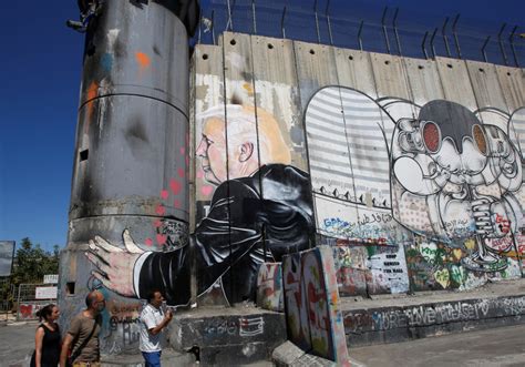 Graffiti artist paints memes on West Bank wall - Israel News ...