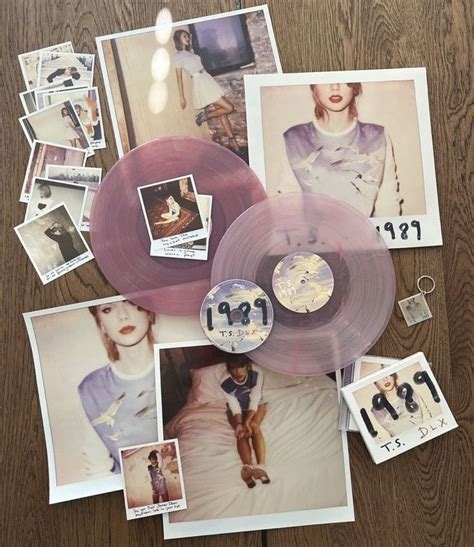 an assortment of pictures and cds on a table