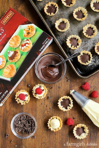 Mini Phyllo Cups With Coconut Cream Raspberries And Dark Chocolate