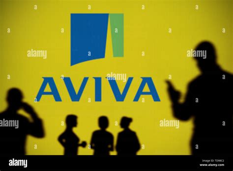 The Aviva Insurance Logo Is Seen On An Led Screen In The Background