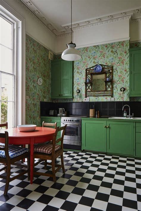 A Whimsical Retro Bright Green Kitchen With Catchy Wallpaper Walls A