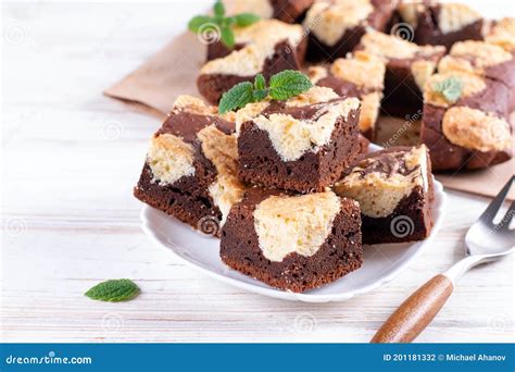 Chocolate Spongy Brownie Cakes With Cookies Brookies In A White Plate