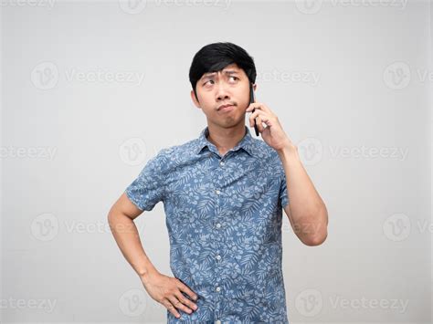 Asian Man Blue Shirt Holding Mobile Phone Gesture Thinking Something