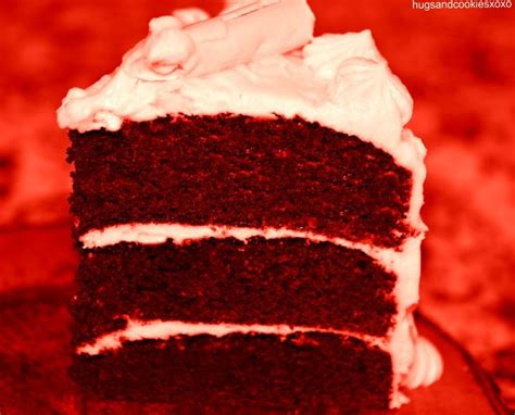 A Slice Of Red Velvet Cake With White Frosting