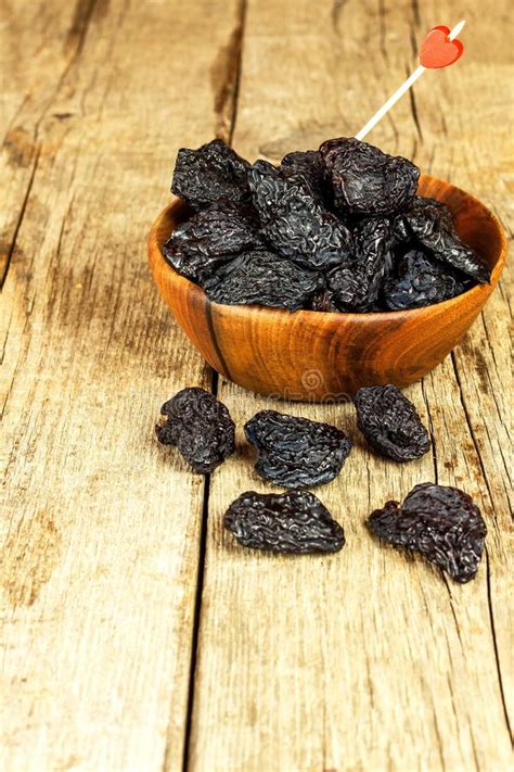 Prune, Dried Plums Fruits On Rustic Wooden Background. Dry Plums In A ...