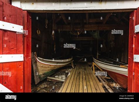 Traditional Red Wooden Houses Rorbuer In The Small Fishing Village Of