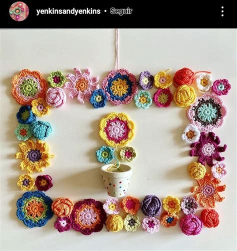 Crocheted Flowers Are Arranged In The Shape Of A Letter O On A White