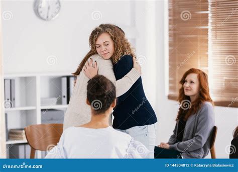 Two Woman Comforting Each Other During Psychotherapy For Abuse Victims