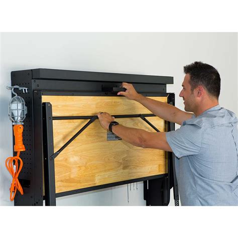 The Wall Mounted Folding Workbench Hammacher Schlemmer