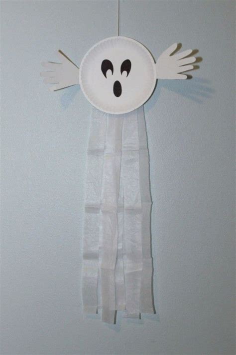 Making A Paper Plate Ghost Ghost Crafts Halloween Preschool