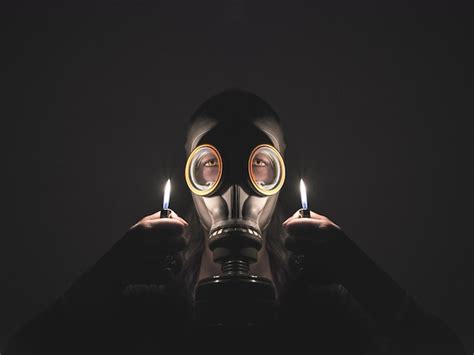 Premium Photo Close Up Of Man Wearing Mask Against Black Background