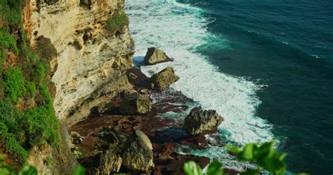 Limestone Rocky Coastline With Transparent Ocean Water In Uluwatu Bali