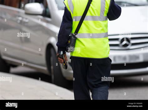 A Traffic Warden On Patrol In London Britain Stock Photo Alamy