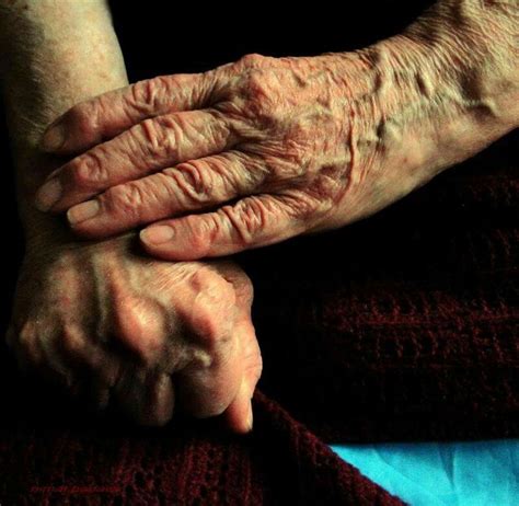 An Older Person Holding Their Hands Together