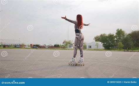 Slim Woman In Sports Overalls Rollerblading Beautiful Happy Girl