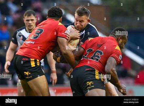 Mike Cooper Of England Is Tackled By Mckenzie Yei And Jacob Alick Of