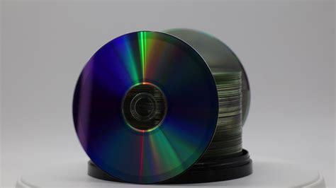 premium stock video  stack  dvds rotating  white background