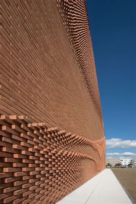 An Undulating Brick Facade Imitates the Free-Flowing Movement of Draped