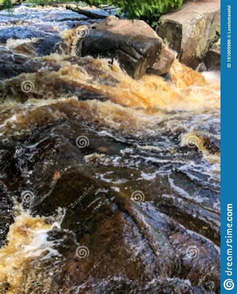 Scenic View Of Water Flowing Down Rocks In Lake Stock Photo Image Of