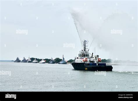 Fireboat sailing along Russian naval forces parade warships with ...