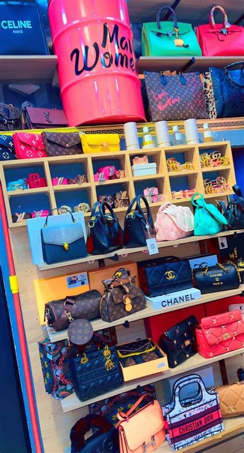 Many Purses And Handbags Are Displayed On Shelves