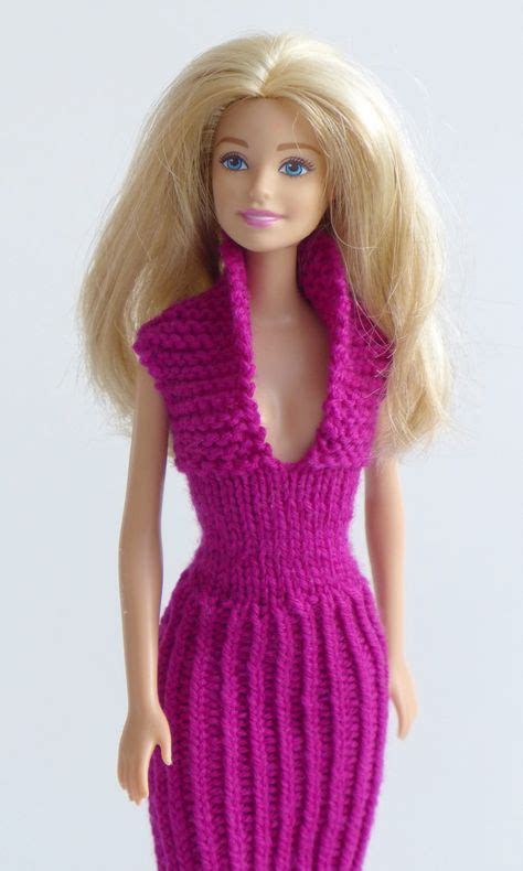 A Barbie Doll Wearing A Purple Knitted Dress