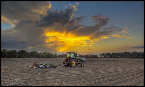 John Deere Sunset Shot Of A John Deere Tractor Foreground Flickr