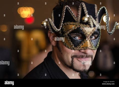 A Man Wearing A Masquerade Ball Mask Stock Photo Alamy