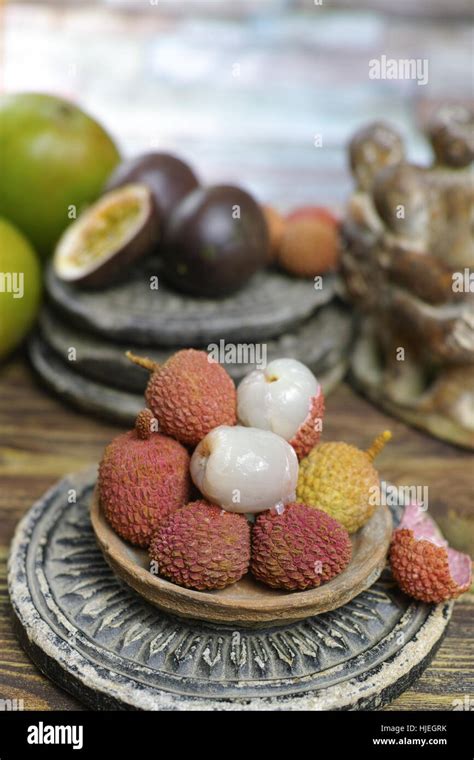 Tropical Fruits Lychees And Passion Fruit Or Maracuya And Mango On Wooden Background Stock