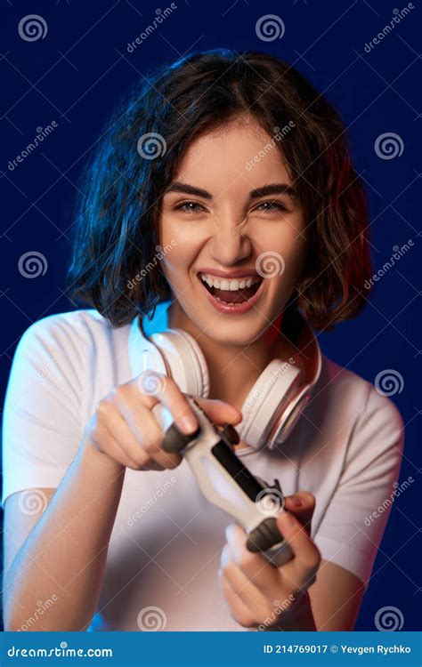 Happy Curly Involved Gamer Girl Playing Video Games Stock Image