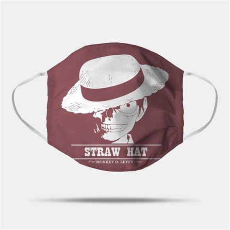 a face mask with the words straw hat and a skull wearing a fedora on it