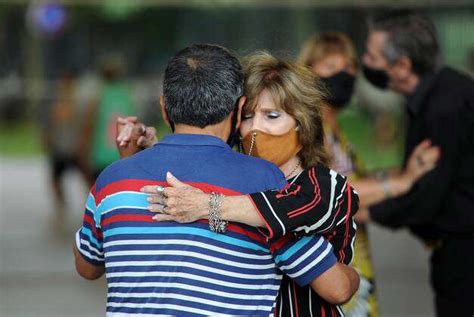 Several Couples Dance Tango In Chacabuco Park In Buenos Aires