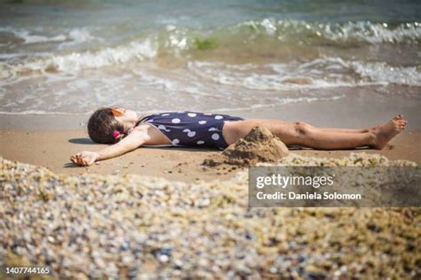 3,456 Girl Lying On Beach Stock Photos, High-Res Pictures, and Images