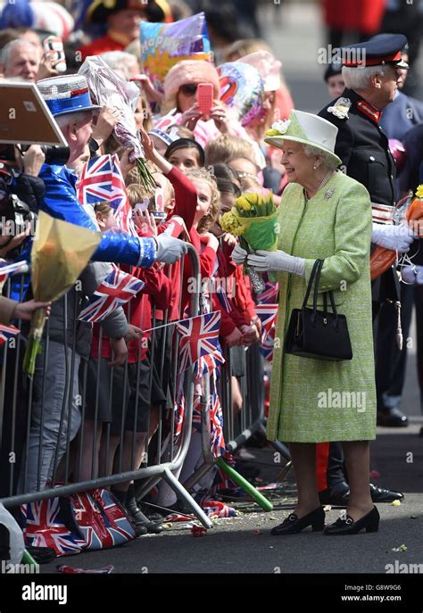 Queen Elizabeth Ii Meets Well Wishers During A Walkabout Close To