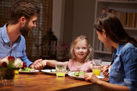 Family Eating Dinner at a Dining Table Stock Photo - Image of domestic ...