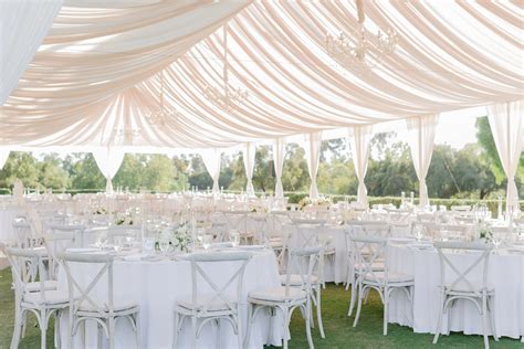 All-White Tent Decor with Fabric Draping