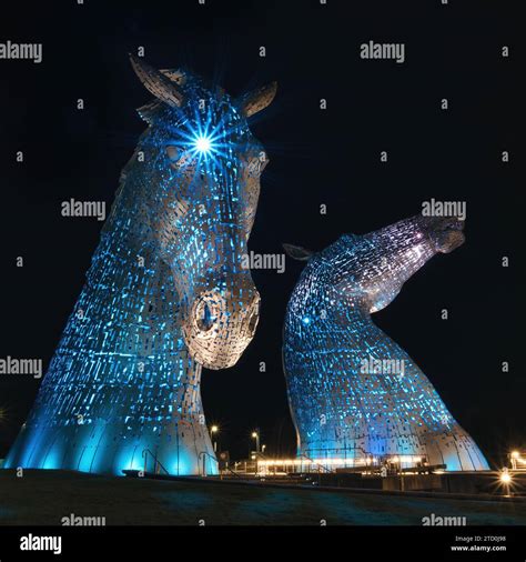 The Kelpies Illuminated At Night Stock Photo Alamy