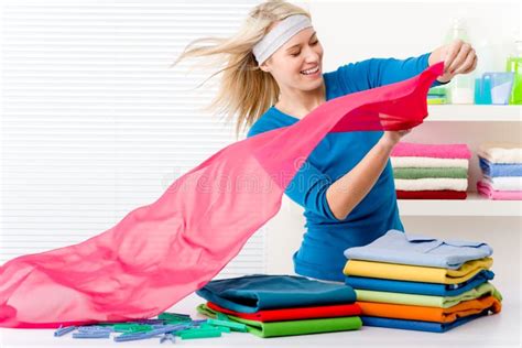 Laundry - Woman Folding Clothes Stock Photo - Image of blond, young ...