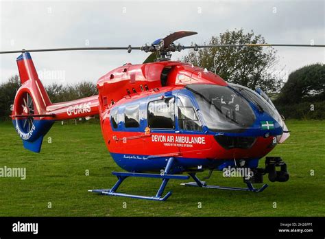 The Devon Air Ambulance Helicopter In A Field At Burton Bradstock In